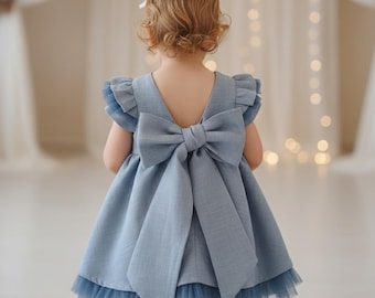 Elegant blue linen dress with tulle details, short and long sleeve options, ideal for special occasions and weddings.