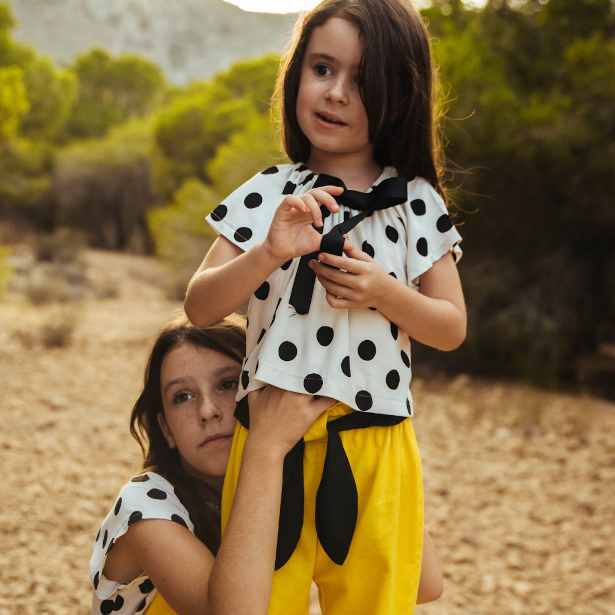girls black and white polka dot shirt