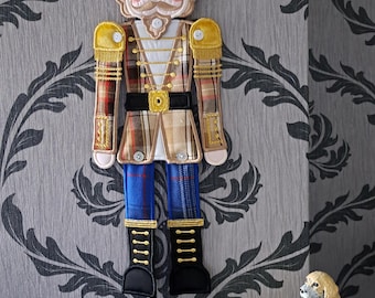 embroidered nutcracker wall hanging