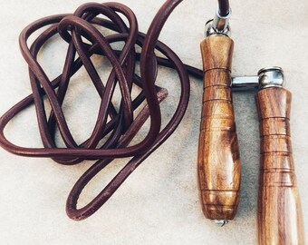 Vintage style wooden handle leather skipping rope, jumping rope, workout and training equipment.