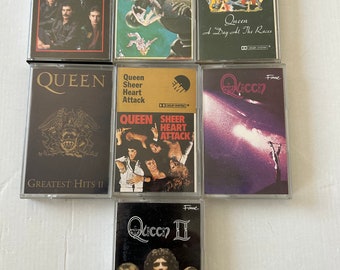 Queen,Deep Purple,Ozzy Osborne,Depeche Mode,Jimi Hendrix,Scorpions,Ian Gillian,Freddie Mercury,Queen some stickers on spines of Cardboard