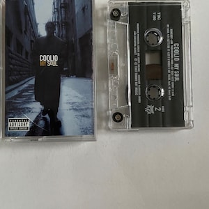 May include: A cassette tape of Coolio's album "My Soul" with a black and white photo of Coolio on the front cover. The album cover features a parental advisory label.