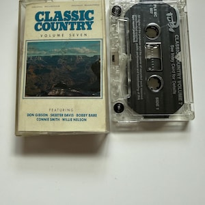 May include: A Classic Country Volume Seven cassette tape with a clear plastic case. The inlay features a landscape image of the Grand Canyon and lists artists including Don Gibson, Skeeter Davis, Bobby Bare, Connie Smith, and Willie Nelson.