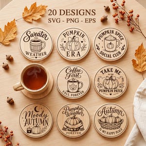 May include: Eight circular wooden coasters featuring engraved autumn-themed illustrations and text including Sweater Weather, Pumpkin Era, Pumpkin Spice Social Club, Coffee First, Take Me To The Pumpkin Patch, Moody Autumn, Pumpkin Weather, and Autumn.