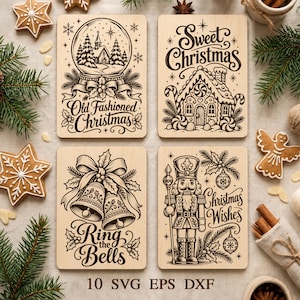 May include: Four rectangular light wood plaques featuring dark brown laser-engraved holiday illustrations. Designs include a snow globe with a church, a gingerbread house with the text Sweet Christmas, two bells with Ring the Bells, and a nutcracker with Christmas Wishes.