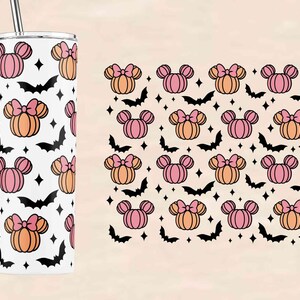 May include: A white tumbler with a pattern of pink and orange pumpkins with black bows and bats. The tumbler has a black straw.