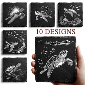 May include: Set of ten black slate coasters, each featuring a unique white engraved design of sea turtles in various underwater scenes. The coasters are square-shaped and showcase detailed artwork.