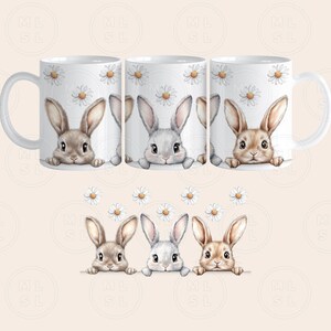 May include: Set of three white ceramic mugs with a floral design and a bunny peeking over the rim of each mug.