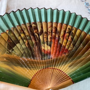 Vintage wood and ribbon decorative hand fan.