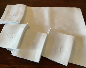 A superb antique french hand stitched hand embroidered monogrammed tablecloth and twelve napkins absolutely fabulous