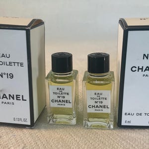 Two vintage CHANEL No.19 EDT miniature 4 ml bottles in original boxes with contents..