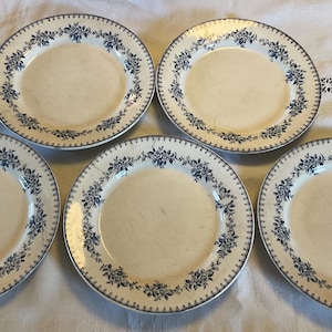 Five Antique french “terre de fer” Dinner plates plates circa 1900 with blue floral design absolutely fabulous.