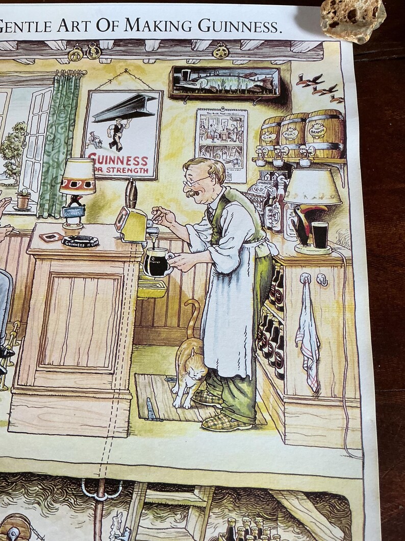 May include: Illustration of a pub scene with a man pouring a dark beer. The image features a cat, barrels, and a sign that reads "Guinness for Strength." The text "Gentle Art Of Making Guinness" is at the top.