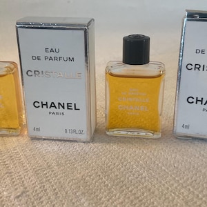 Two vintage CHANEL CRISTALLE EDP parfum miniatures in original boxes with contents..