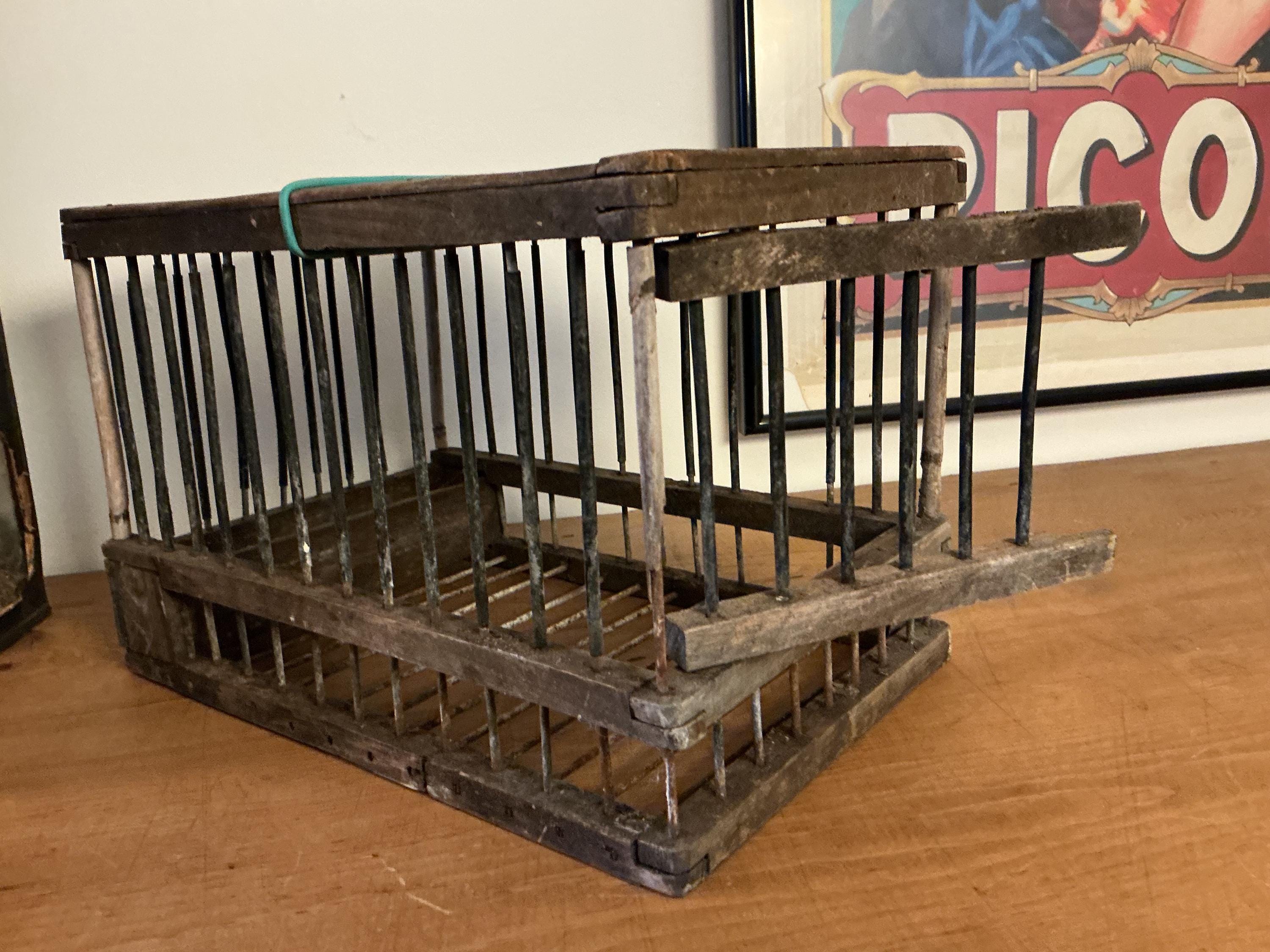 Antique French rustic wirework and wood birdcage .