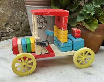 Vintage 1950’s french wooden toy car with moveable blocks.