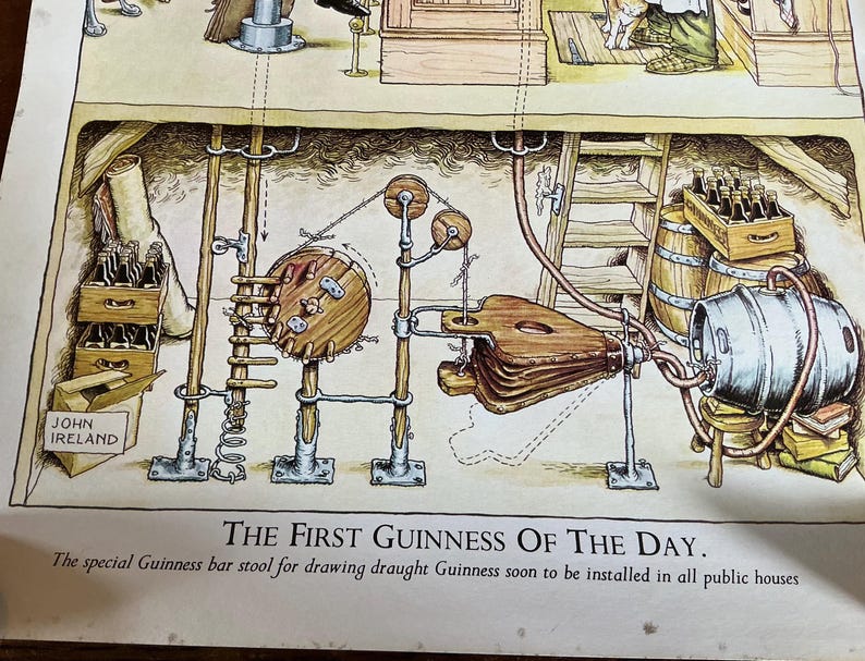 May include: An illustrated diagram of a Guinness draught system, featuring a wooden barrel, bellows, and a series of pipes and pulleys. The text reads "THE FIRST GUINNESS OF THE DAY." and "JOHN IRELAND."
