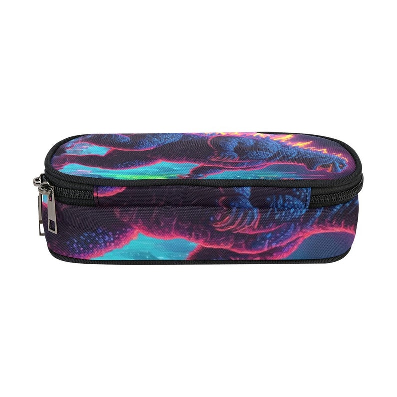 May include: A black pencil case with a zipper closure. The case features a colorful graphic print of a Godzilla-like monster with neon pink, blue, and green accents.