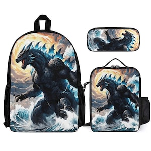 May include: A three-piece school set featuring a black backpack, a lunch bag, and a pencil case. All three pieces have a colorful graphic print of a blue and black monster emerging from the water.