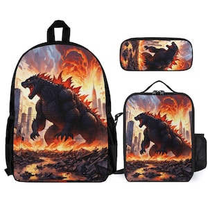 May include: A black backpack, lunch bag, and pencil case set featuring a Godzilla-like monster with fiery orange and yellow flames in the background. The monster is standing in front of a city skyline.