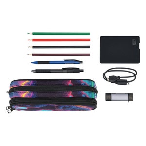 May include: A black pencil case with a colorful galaxy print and two zippers. The case is open and contains a variety of pencils, pens, and other school supplies.