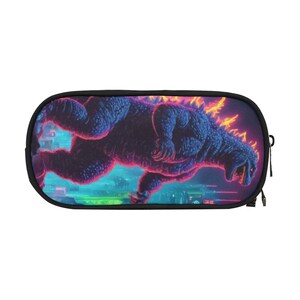 May include: A black pencil case with a colorful image of a Godzilla-like monster in a neon-colored landscape.