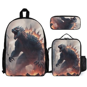 May include: A black backpack, lunch bag, and pencil case set featuring a Godzilla graphic. The backpack has a large pocket on the front and adjustable straps. The lunch bag has a zipper closure and a handle. The pencil case has a zipper closure.