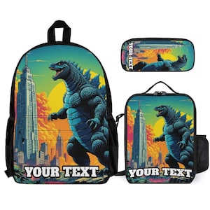 May include: A backpack, a lunch bag, and a pencil case set featuring a blue monster graphic against a city skyline with a yellow sun. Each item displays the text YOUR TEXT in white block letters at the bottom, with a black trim and mesh side pockets.