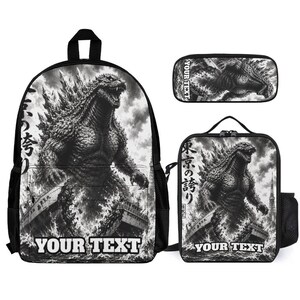 May include: A black and white backpack, lunch bag, and pencil case set featuring a graphic illustration of Godzilla emerging from the ocean near a ship. The text YOUR TEXT is printed at the bottom of the backpack and lunch bag, with Japanese characters on the side.