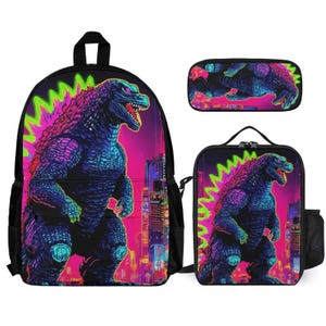 May include: A three-piece school set featuring a black backpack, lunch bag, and pencil case. All three pieces feature a colorful graphic of a Godzilla-like monster in a neon cityscape.