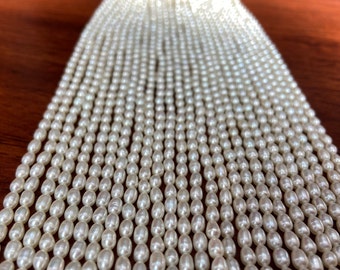 White Freshwater Rice Pearl Strand, 3.5mm Slim Oval Beads