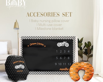 May include: A baby accessories set featuring a black and white motorcycle-themed nursing pillow cover, multi-use cover, and milestone blanket. The milestone blanket is black with a checkered border, motorcycle graphic, and month markers.