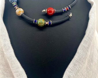 Contemporary rubber necklace with ceramic beads.