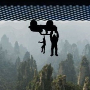Tiny Man and Bigfoot Hanging from Two Door Car Decal