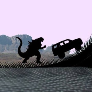 Tiny Godzilla Chasing 4runner Car Decal