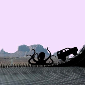Tiny Kraken Chasing SUV Car Decal