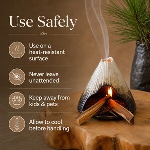 May include: A ceramic incense burner shaped like a volcano, with a lit incense stick inside, emitting smoke. The burner is black and white, sitting on a wooden surface. Text on the image reads "Use Safely" with safety instructions.