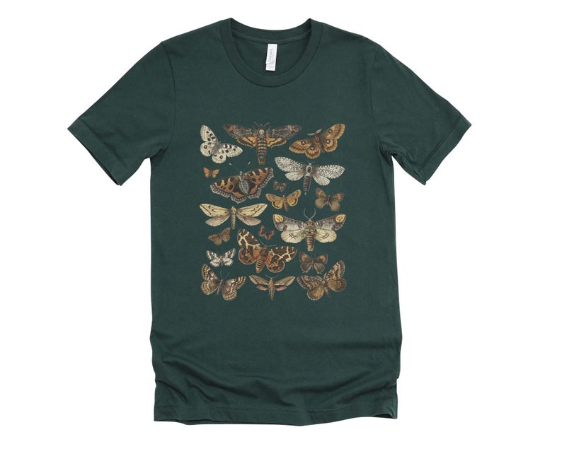 May include: A dark green t-shirt with a print of various moths and butterflies in shades of brown, white, and black.
