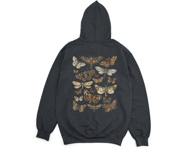 May include: A dark grey hooded sweatshirt featuring a print of assorted butterflies and moths in shades of brown, beige, and white.