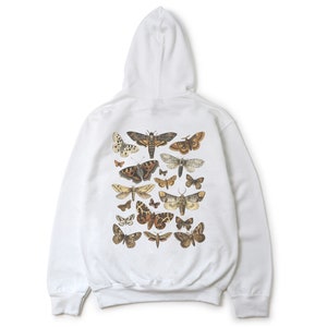 May include: White hooded sweatshirt with a print of various butterflies and moths on the back.