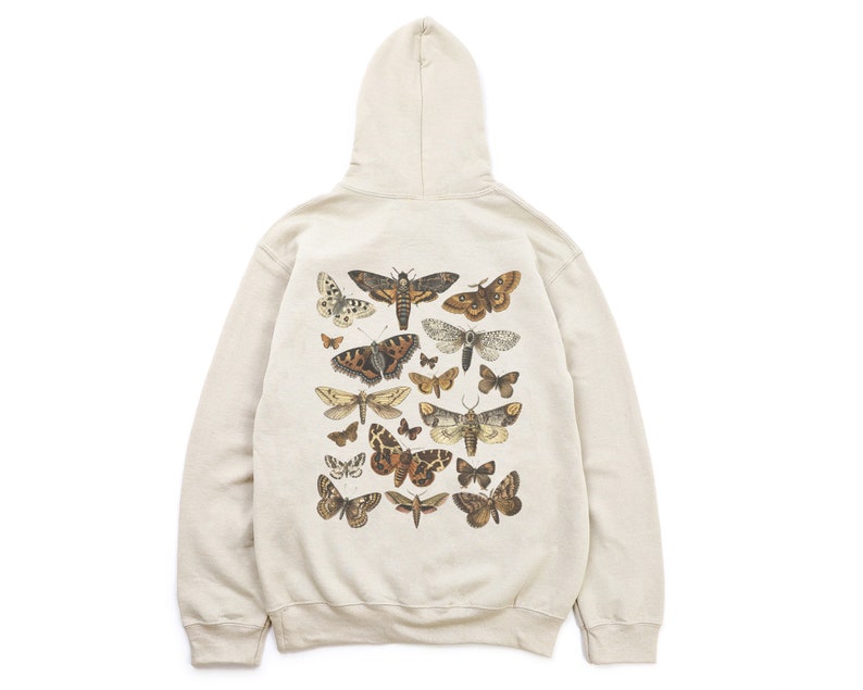 May include: A cream-coloured hooded sweatshirt with a print of various moths and butterflies on the back.