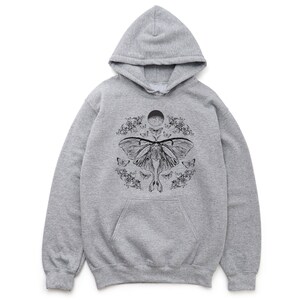 May include: A grey hooded sweatshirt with a black and white graphic print of a moth with a moon and floral accents.