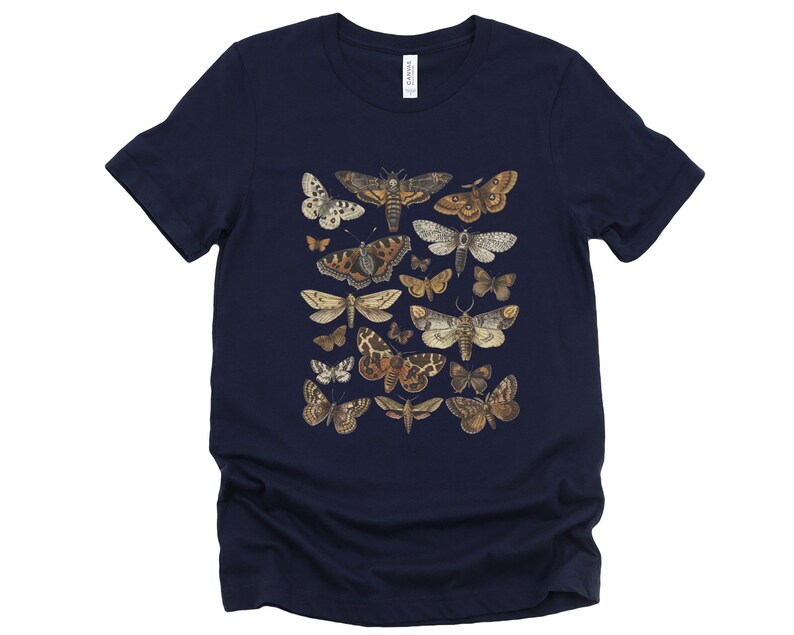 May include: A navy blue t-shirt with a print of various moths in shades of brown, white, and black.