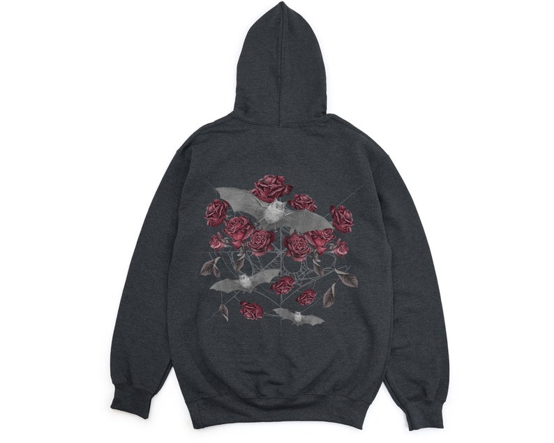 May include: Dark gray hoodie featuring a graphic of bats, red roses, and a spiderweb design. The hooded sweatshirt has a drawstring and a kangaroo pocket. The graphic is centered on the back of the hoodie.