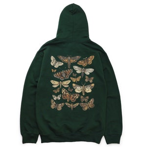 May include: A dark green hooded sweatshirt featuring a print of assorted butterflies and moths in shades of brown, beige, and white.