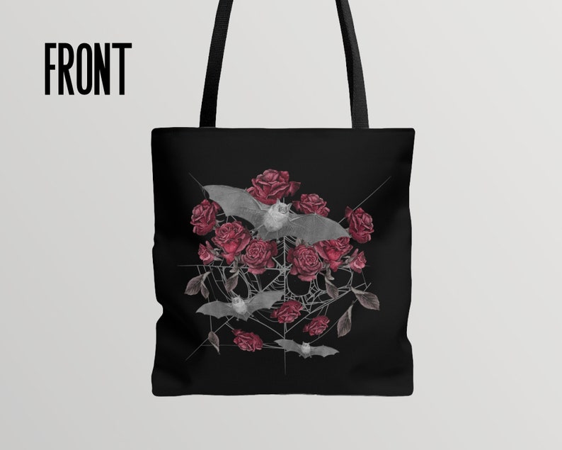 May include: Black tote bag with a design of bats and red roses on a spiderweb. The design is in a circular shape.