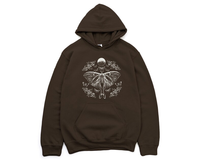 May include: A brown hooded sweatshirt featuring a white graphic print of a moth and moon surrounded by floral designs.