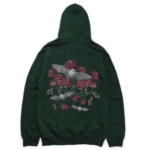 May include: Dark green hoodie featuring a graphic of bats, roses, and spiderwebs. The bats are gray, and the roses are a deep red. The hoodie has a hood and a front pocket.