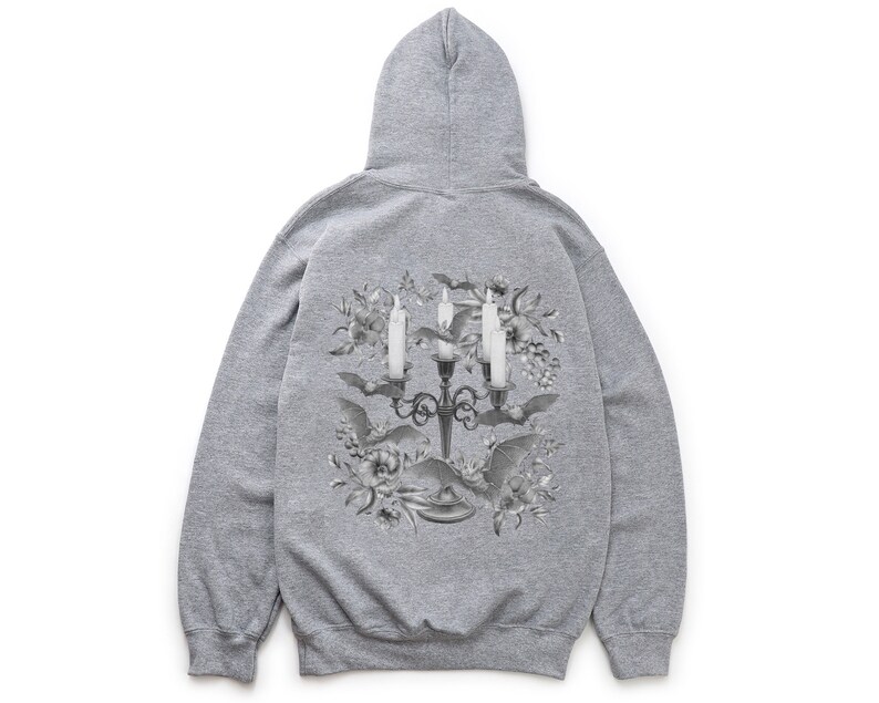 May include: Grey hooded sweatshirt with a black and white graphic print of a candelabra with candles and bats surrounded by flowers.