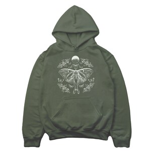 May include: A dark green hooded sweatshirt with a white graphic print of a moth and a crescent moon surrounded by smaller moths.